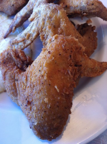 Gold Brown Chicken Wing close up at M'dears Bakery & Bistro Gold Brown Chicken Wing close up at M'dears Bakery & Bistro
