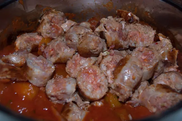 Hot Italian Sausage (sliced) simmering in Ragú® Old World Style® Traditional Sauce