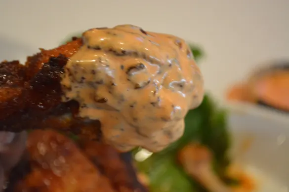 Sriracha Thai Wings dipped in O.G. Chris' Sriracha Ranch at Slater's 50/50 Pasadena
